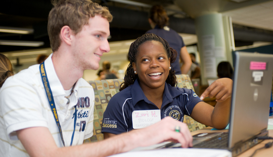 Student talking to prospective student 