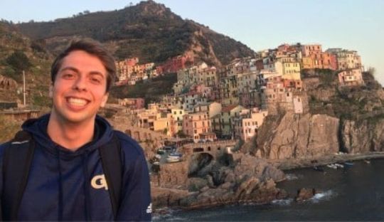 Student standing in front of Cinque Terre