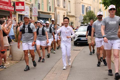 GTE/GT alumnus Louis Chen running in the 2024 Paris Olympics torch relay